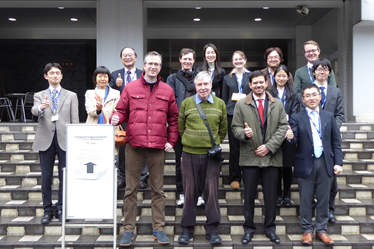 A group photo of attendees, professors and organizers in front of the Institute of Engineering Innovation