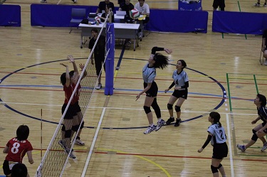 Spiking a ball into the opposing team's court