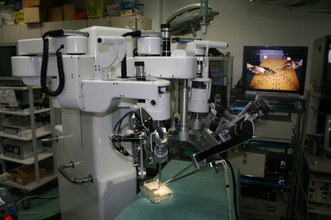 Fig. Slave manipulators, which interact directly with the patient and are located remotely from the surgeon