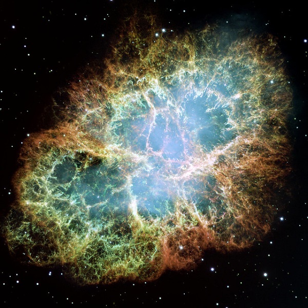 A colorful image of the remnants of an exploded star, Messier 1 or the Crab Nebula.