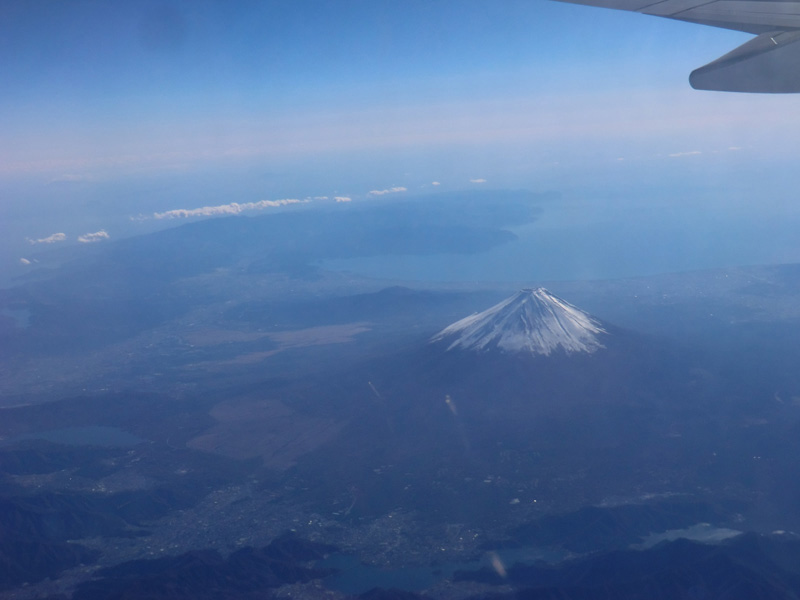 A photo I took out the window on a flight to South Korea to present my report Earthquakes in Mythology. The Izu Peninsula is visible in the distance. The Izu Peninsula collided with the Eurasian Plate, pushing up Mt. Fuji.  © Michihisa Hotate.