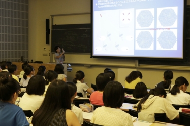 ICRR Assistant Professor Michio Oishi speaking at the event