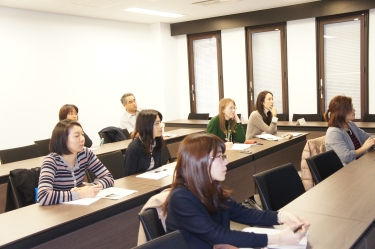 Attendees listening intently during the presentation