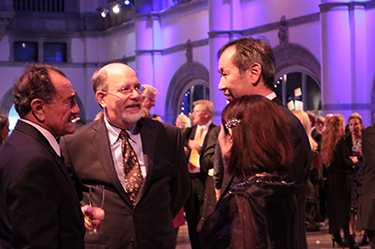 Professor Kajita having a friendly conversation with fellow attendees at the Nordic Museum's dinner party