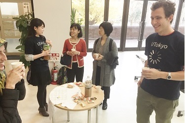 Peter and Saori, T-Party organizers in uniform T-shirts, enjoying interacting with event participants