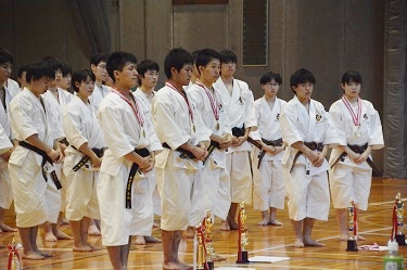 Receiving lots of medals at the awards ceremony