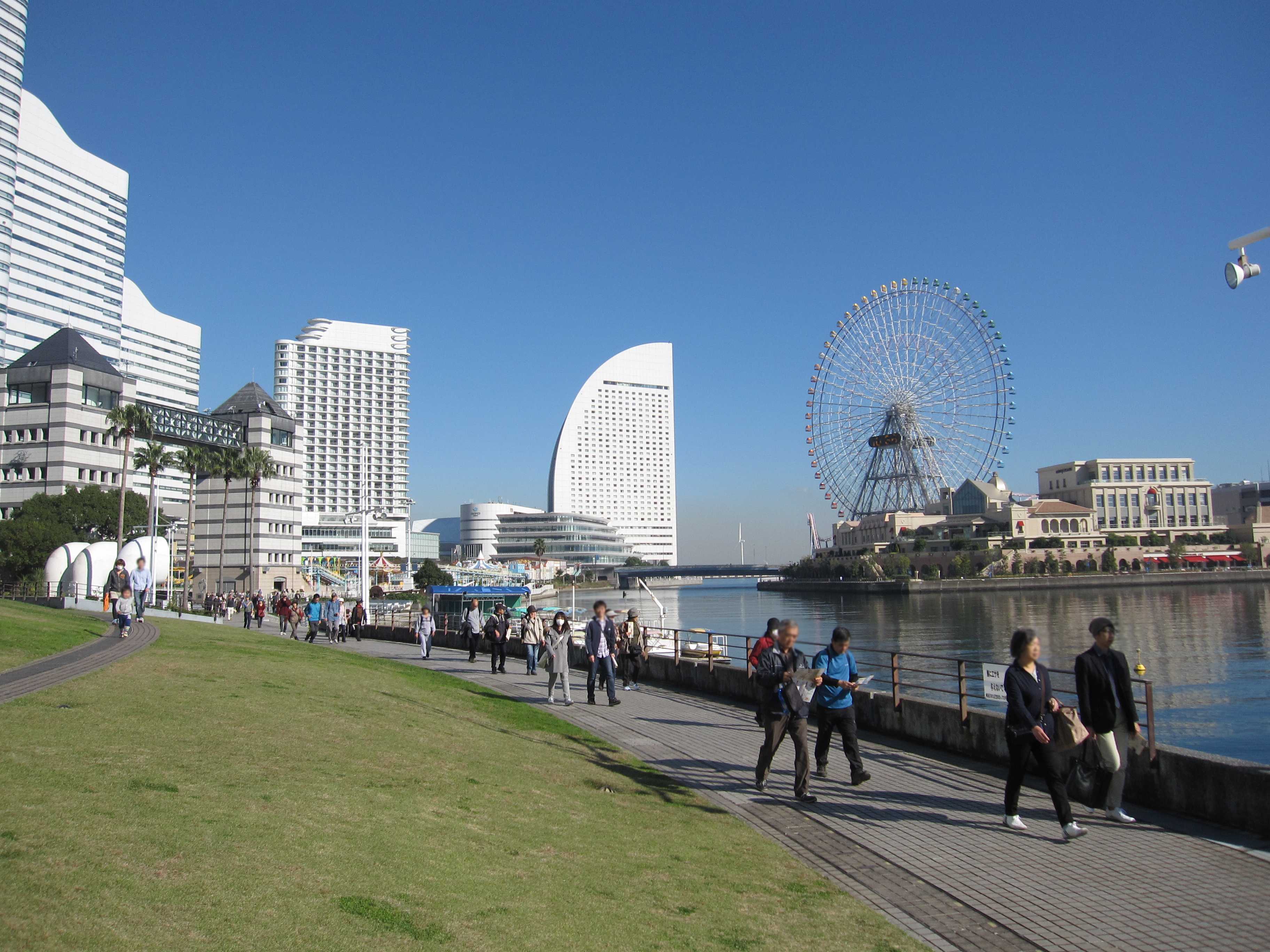 A scene of a city with people walking