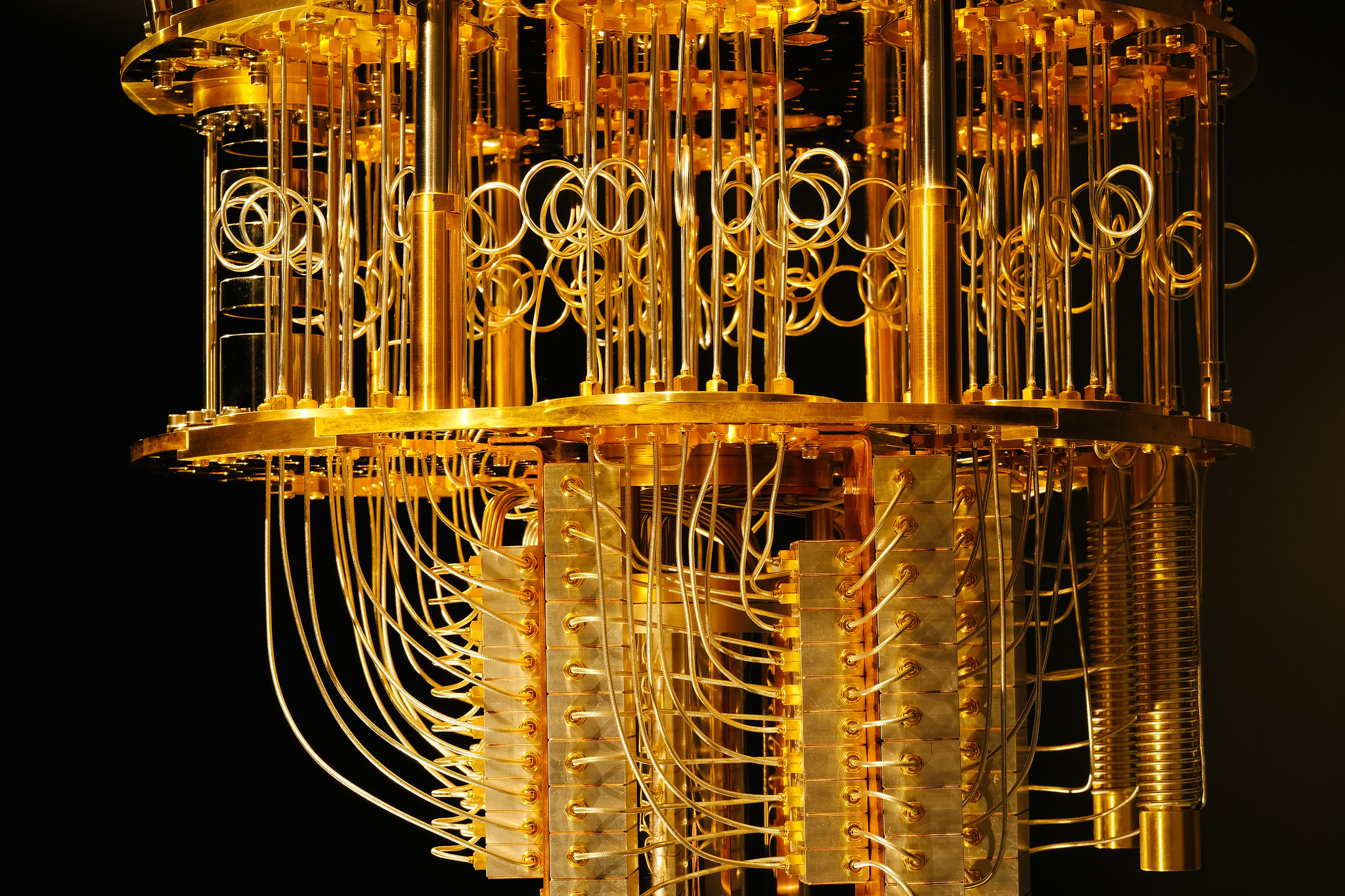 Complicated network of golden machinery on black background