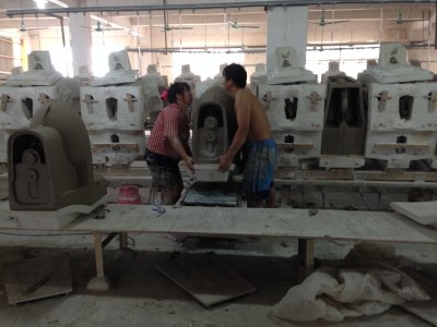 Workers at a sanitary ceramic workshop in Guangdong