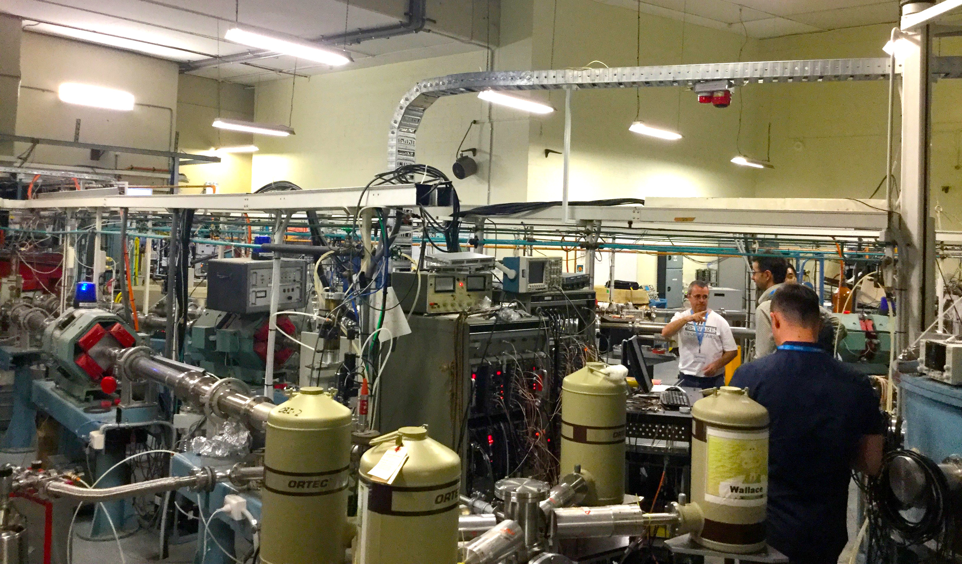 A lab filled with pipes, wires, and containers.