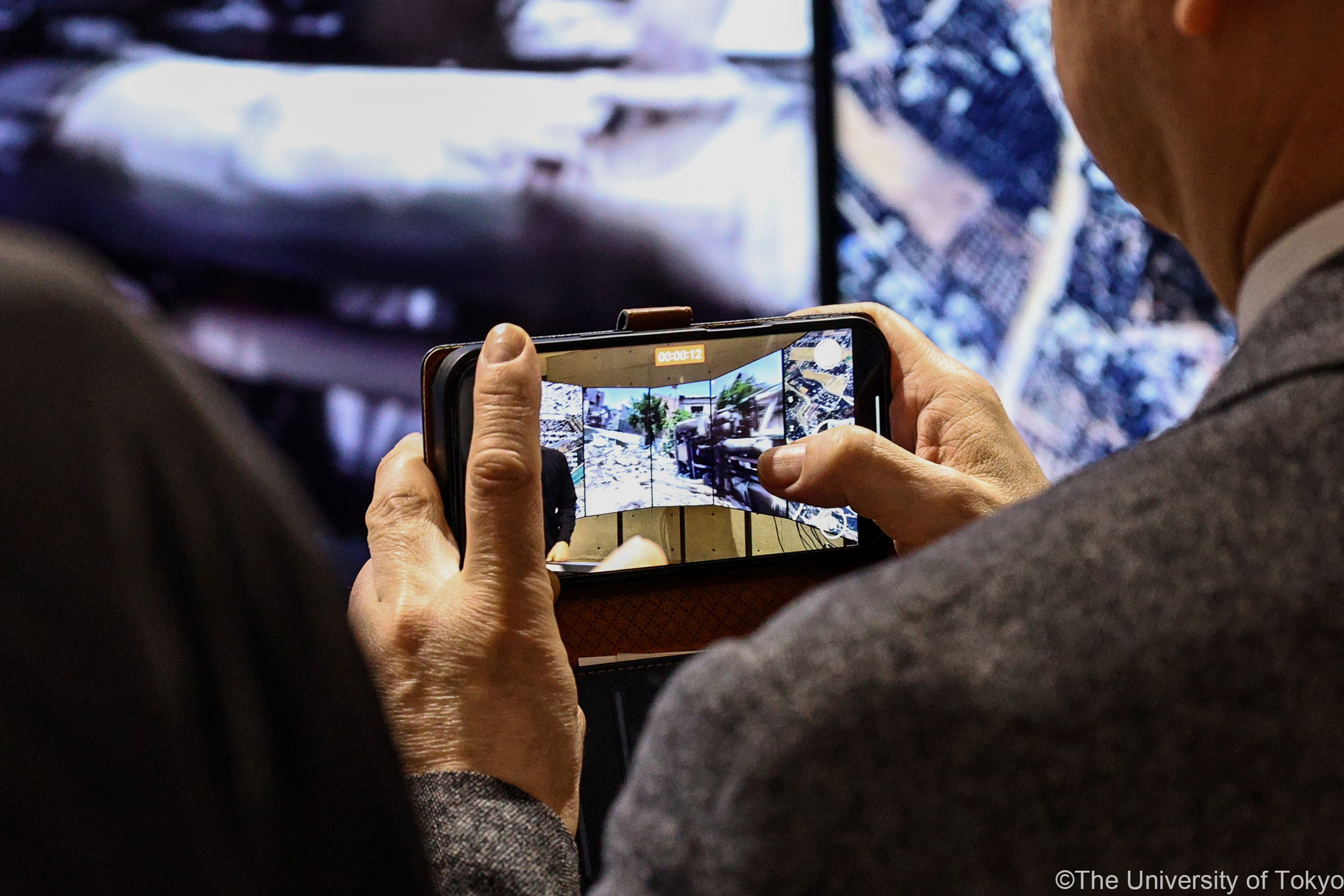An attendee immerses in a 3D environmental recording conveying the destruction.