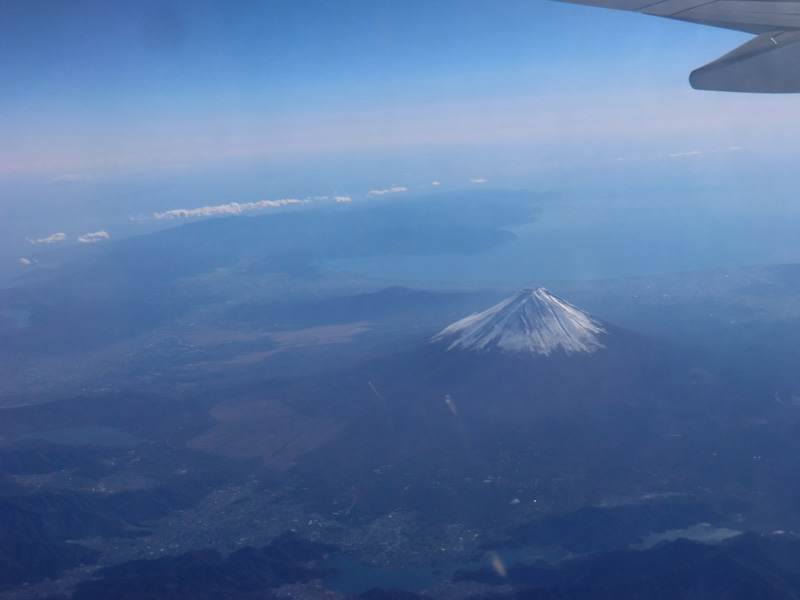 A photo I took out the window on a flight to South Korea to present my report Earthquakes in Mythology. The Izu Peninsula is visible in the distance. The Izu Peninsula collided with the Eurasian Plate, pushing up Mt. Fuji. © Michihisa Hotate.