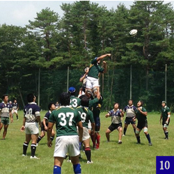 Students playing rugby on field at Yamanaka Dormitory